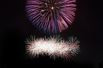 Awesome isolated Festive fireworks on a dark background. Can be used as wallpaper or background