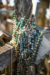 Beads and wooden crosses and crucifixes at the Hill of Crosses.