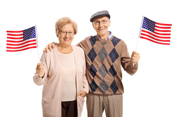 Senior couple with American flags