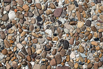 fragment of surface with decorative filling with sea pebbles