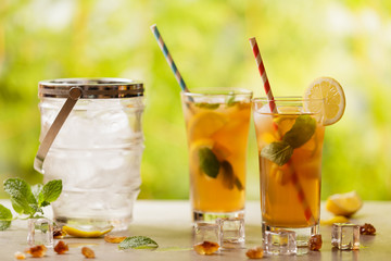 Iced tea with lemon and ice cubes