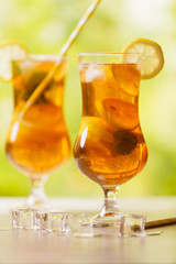 Iced tea with lemon and ice cubes