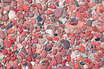 fragment of surface with decorative filling with sea pebbles