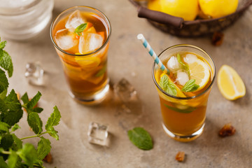 Iced tea with lemon and ice cubes