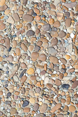 fragment of surface with decorative filling with sea pebbles