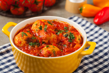 Chicken meatballs with tomato sauce. Served with rice.
