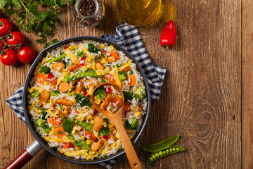 Nasi goreng. Fried rice with egg and vegetables.