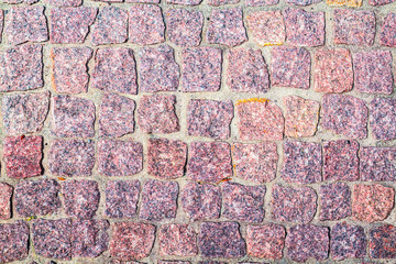 fragment of granite pavers in different color schemes