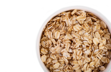 pile of oatmeal isolated on white background. Creative layout made of organic oatmeal isolated on white background. Food concept.