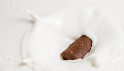 Chocolate falls in milk