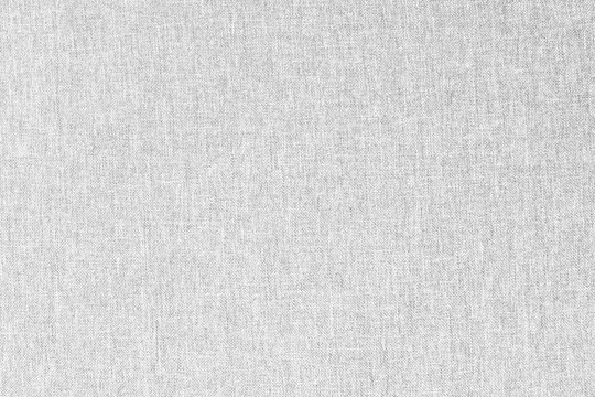 Gray canvas texture for background with visible fibers.