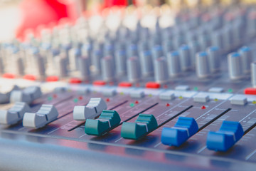 Slide the audio mixer in the control room.