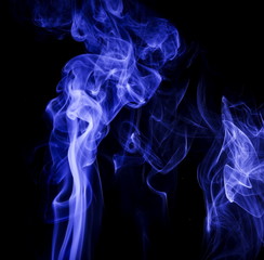 Blue smoke on black background