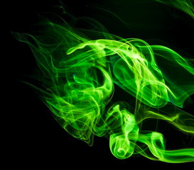 Green smoke on black background