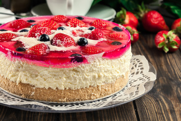 Cheesecake with strawberries, blueberry and jelly