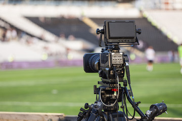 tv camera records on football matches - Powered by Adobe