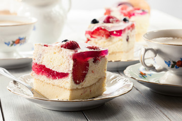 Cheesecake with strawberries, blueberry and jelly