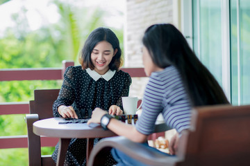 Asian girls playing domino game