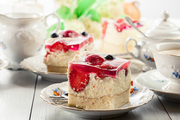 Cheesecake with strawberries, blueberry and jelly