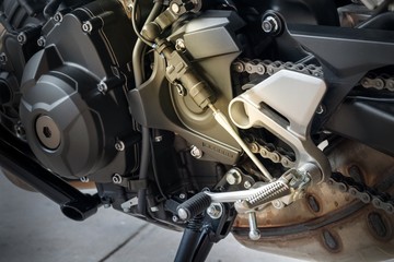 Close up of QuickShifter sensors with gearshift, is a device that allows clutchless gearshift on a manual transmission, and is commonly used on Sport motorcycles.