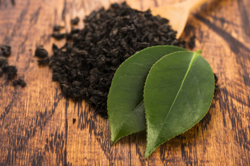 Dry tea and green leaves