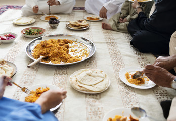 Muslim family having dinner on the floor