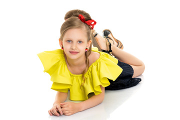 Little girl lies on the floor