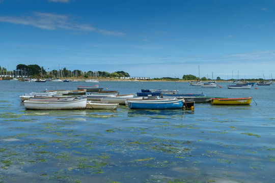 Small boats at high tide, Emsworth, Hampshire, UK.