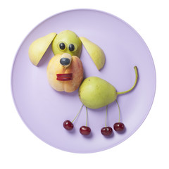 Funny fruit dog made on purple plate
