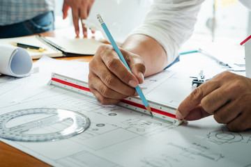 Worker engineer housing plan architect drawing paper of structure.