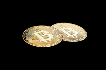 Golden Bitcoins on black background.Virtual money.