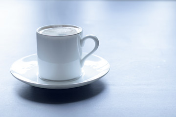 Obraz na płótnie Canvas White coffee mug with steam top