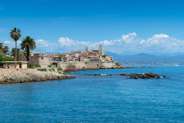 Naklejka premium The old town of Antibes and defensive stone walls occupying a prominant position on the Mediterranean, French Riviera.