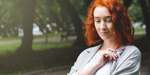 Portrait of a girl with red hair