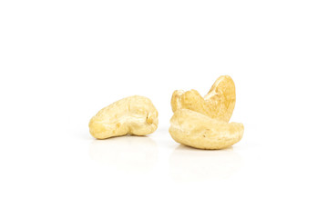 Group of three whole raw cashew nut isolated on white background