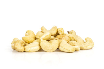 Lot of whole raw cashew nut heap isolated on white background