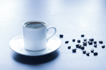 A cup of fragrant hot coffee on the morning table