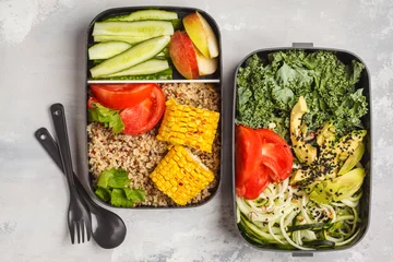  Healthy meal prep containers with quinoa, avocado, corn, zucchini noodles and kale. Takeaway food. © vaaseenaa