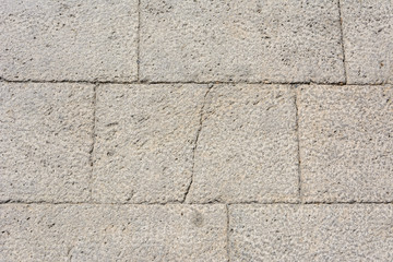 background cobbles of light-colored stone with a crack down the middle