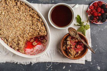 Breakfast with coffee and crumble pie, dark background, healthy vegan breakfast concept.