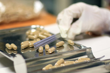 Pharmacy use pill counting tray for dispensing customer or patient in drugstore. Pill counting tray with drug.