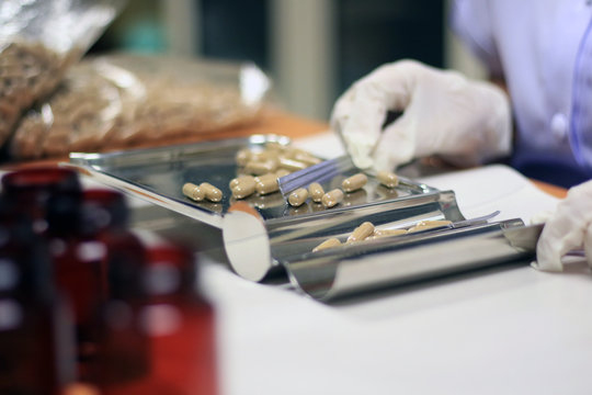 Pharmacy use pill counting tray for dispensing customer or patient in drugstore. Pill counting tray with drug.