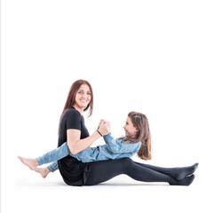 Loving mother and her daughter child girl playing and hugging on white background. Concept of happy. Studio shoot