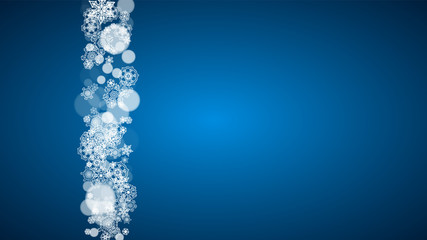 Snowflakes falling on blue background. Christmas and New Year horizontal theme. Frosty falling snowflakes for banners, gift card, party invitation, compliments and special business offer