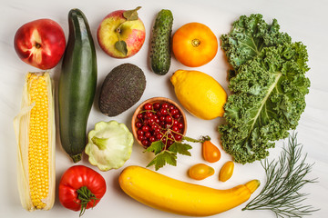 Colored fresh fruits, vegetables and berries on a white background. Clean eating concept.