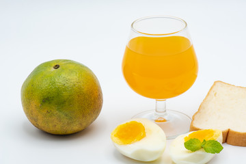 Glass of orange juice with heathy foods