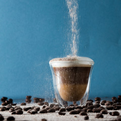 Empty glass and coffee beans