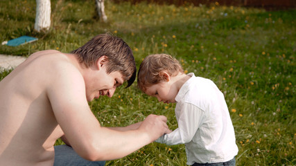 child in glasses on the grass