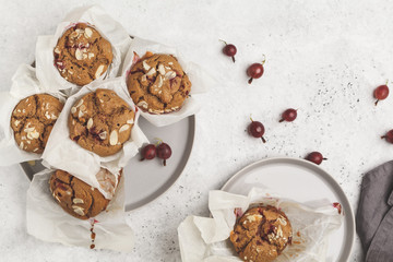 Berry oatmeal muffins on a white background, top view. Healthy vegan dessert.