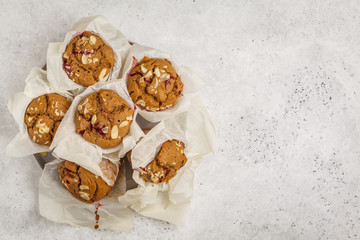 Berry oatmeal muffins on a white background, copy space, top view. Healthy vegan dessert.